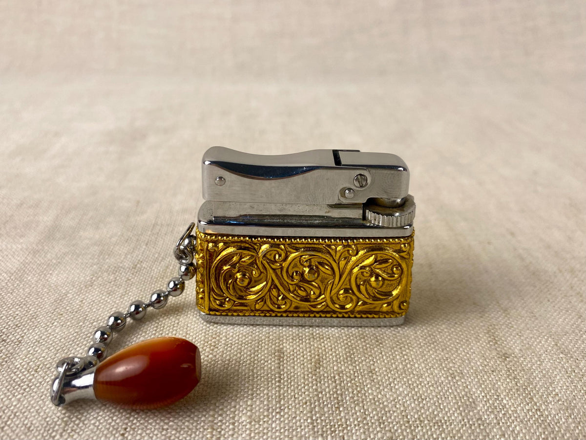 Vintage Sarome Baby Gas Lighter – Ornate Gold Tone with Red Cabochons – Boxed