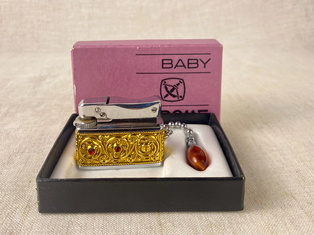 Vintage Sarome Baby Gas Lighter – Ornate Gold Tone with Red Cabochons – Boxed