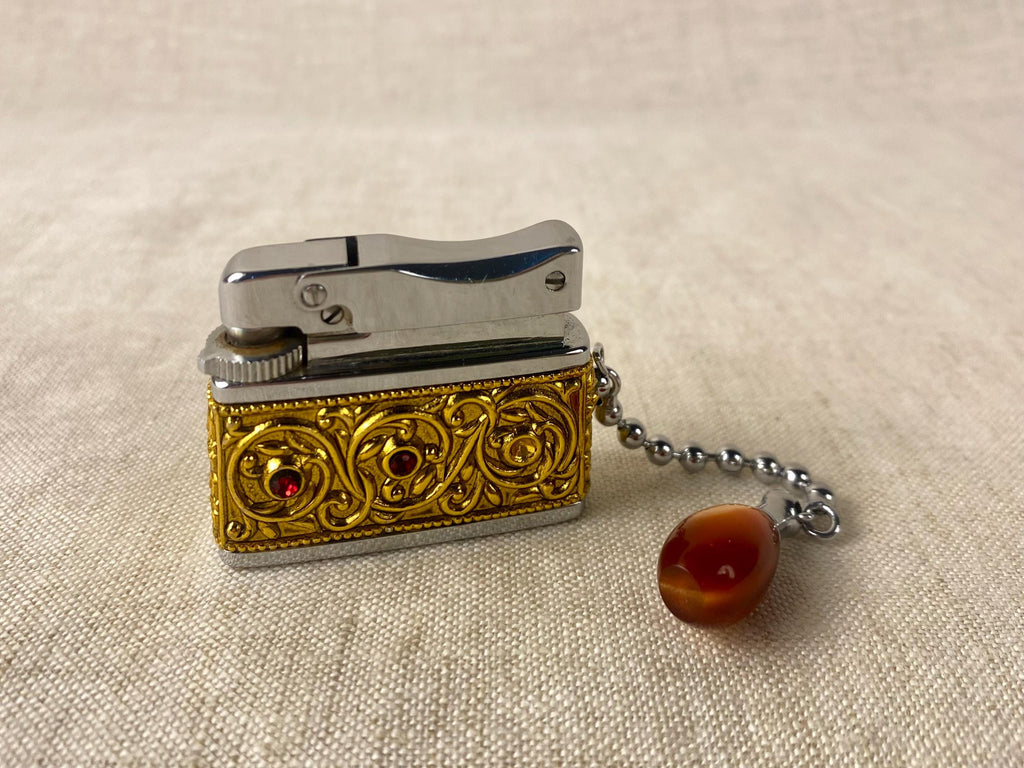 Vintage Sarome Baby Gas Lighter – Ornate Gold Tone with Red Cabochons – Boxed